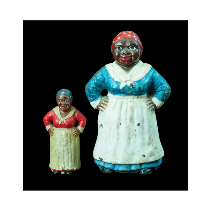 Lot 181: Two Cast Iron "Mammy" Figures