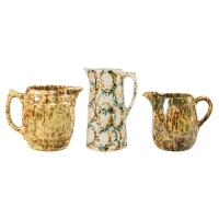 Lot 79: Three Spongeware Pitchers